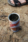 Tea brewed in an old tin in a tea garden Yi Wu