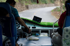 Bus driver filling his cup of tea in the mountains of Yunnan