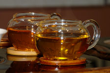 Comparison of two deep golden liquor Zi Cha ancient trees