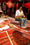 stalls New Year decorations at a market in Lincang