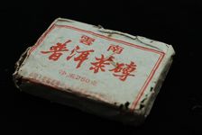 brick puerh <span class='translation'>(Pu Er tea)</span> sold by CNNP in the 80